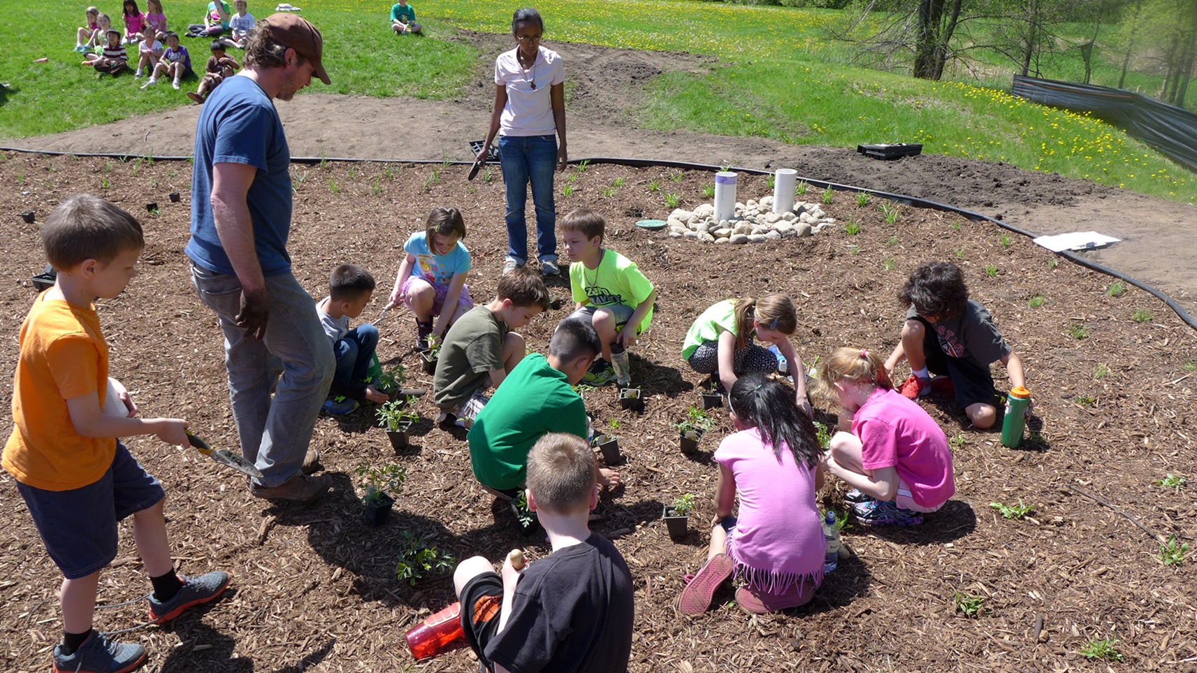 Image slide of VHE students were involved in the planting. 
