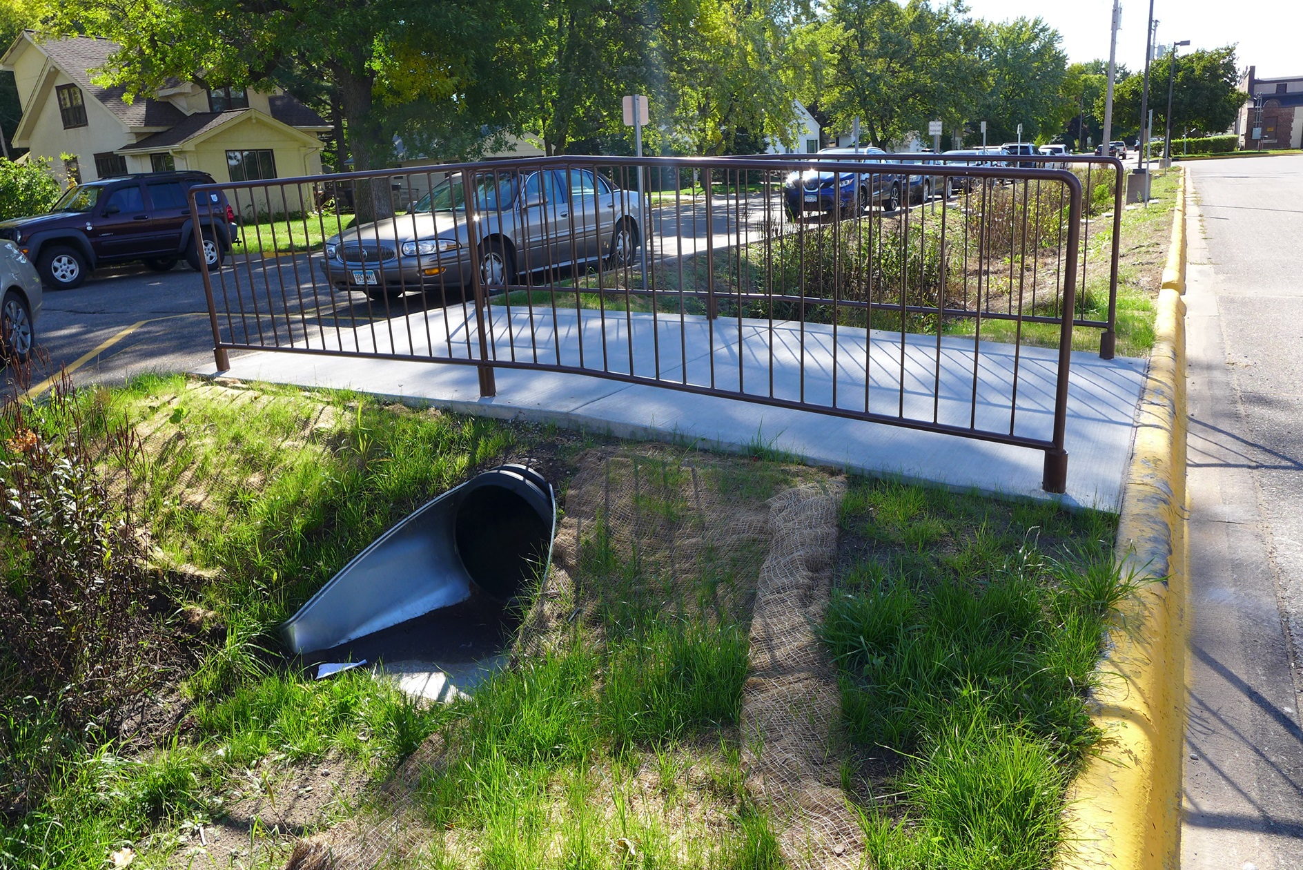 Image slide of Footbridge and culvert dividing the bioswale